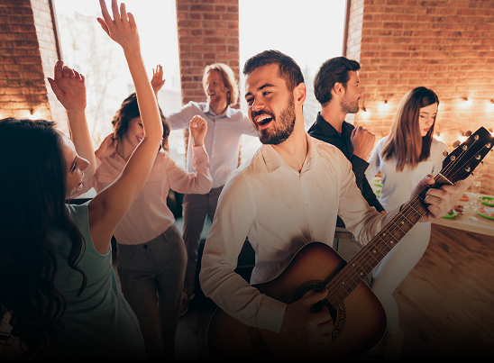 Group enjoying a party with live music.
