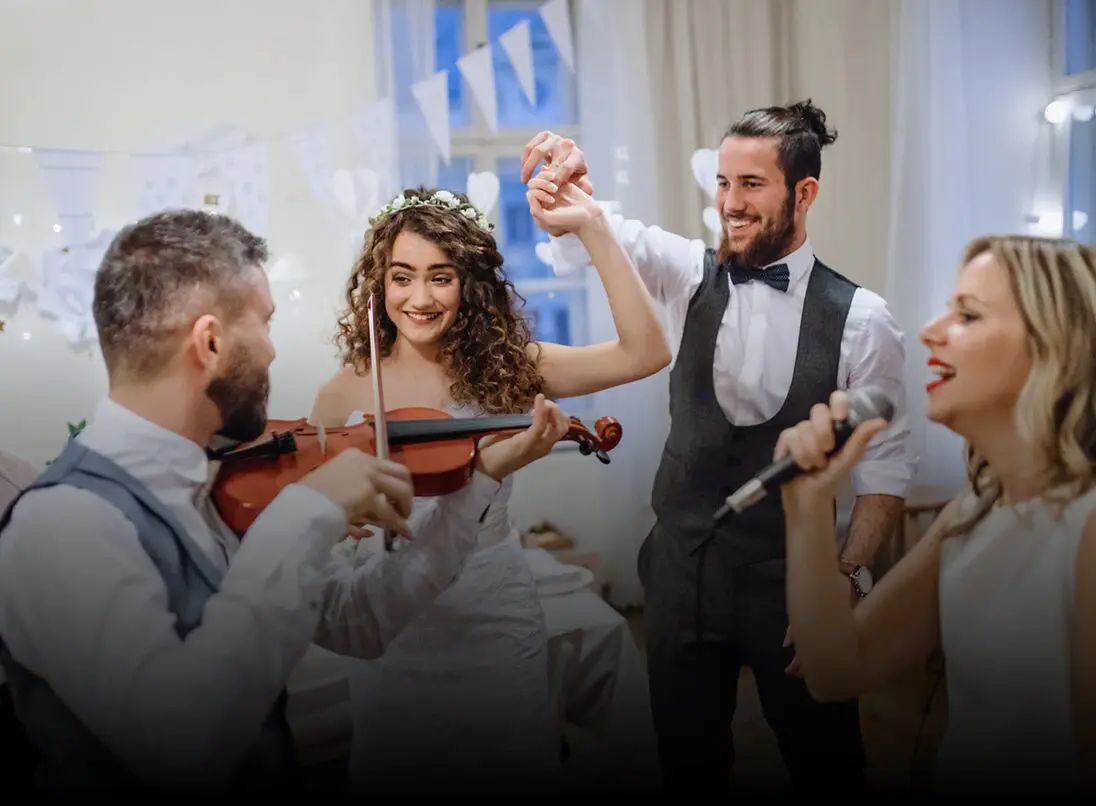 Bride and groom dancing with live music.